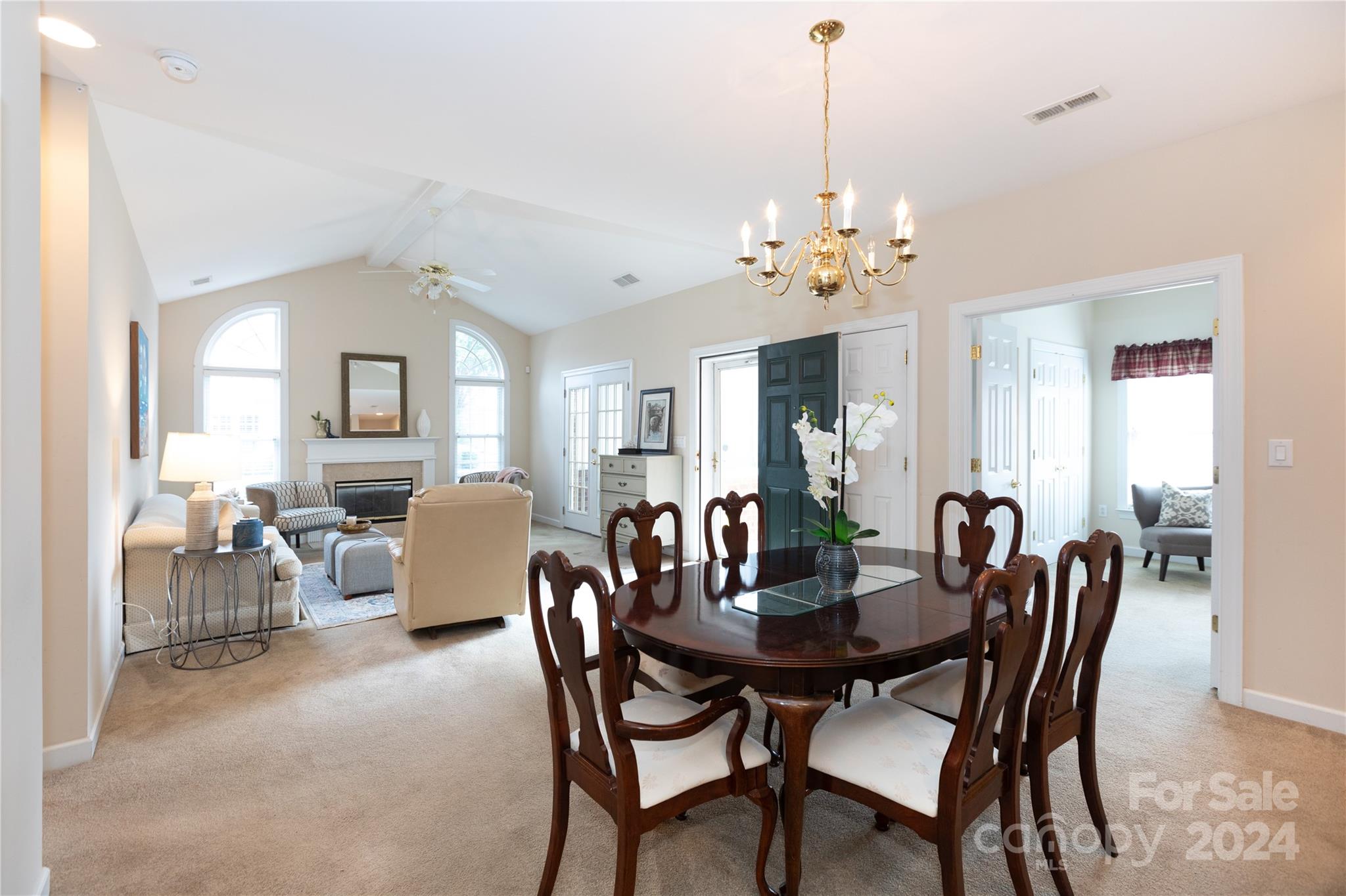 8368 Windsor Ridge Drive Charlotte, NC 28277 - Photo 7 of 28 a view of a dining room and livingroom with furniture wooden floor a chandelier