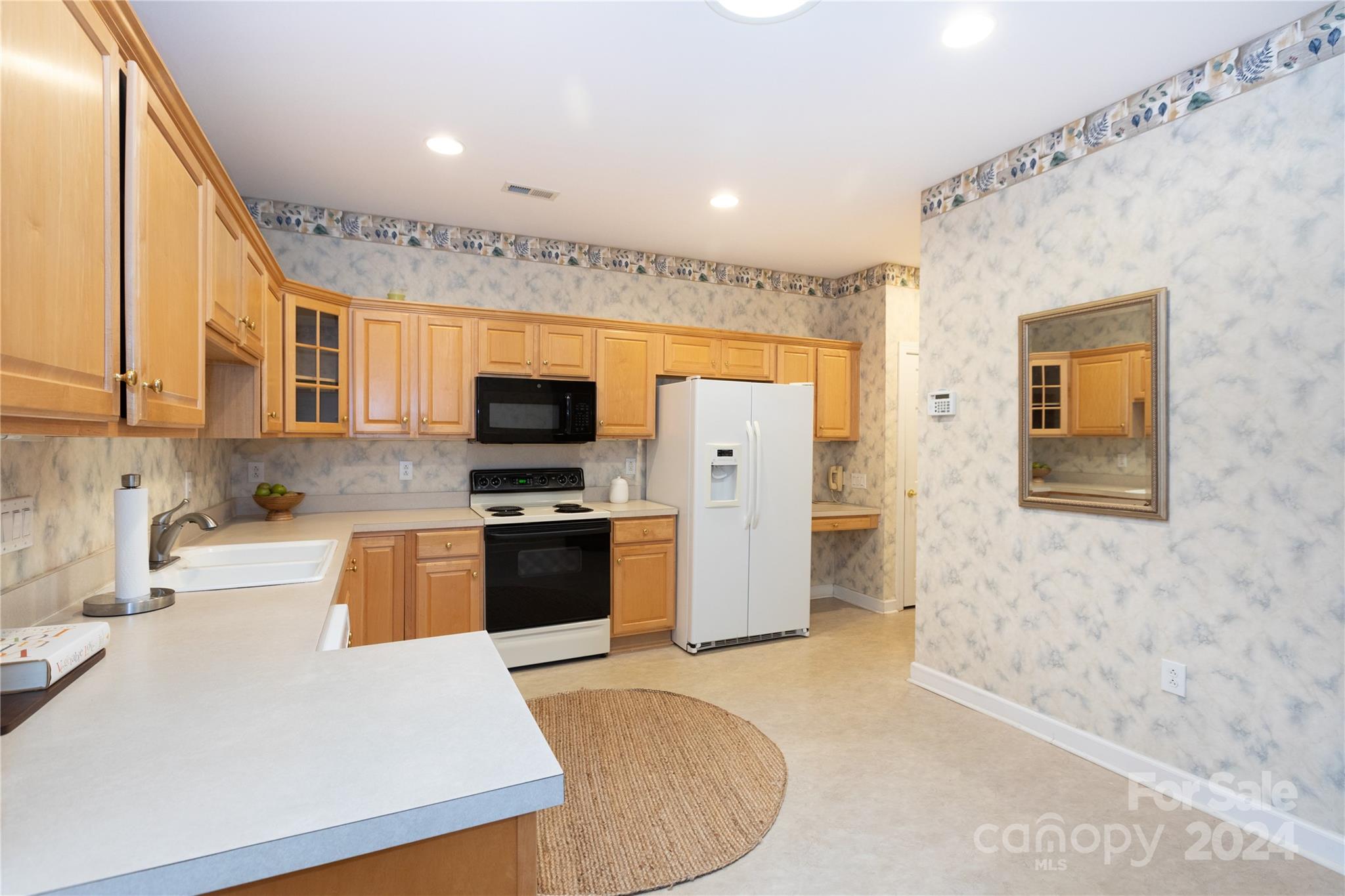 8368 Windsor Ridge Drive Charlotte, NC 28277 - Photo 9 of 28 a kitchen with stainless steel appliances granite countertop a refrigerator a stove top oven a sink and dishwasher