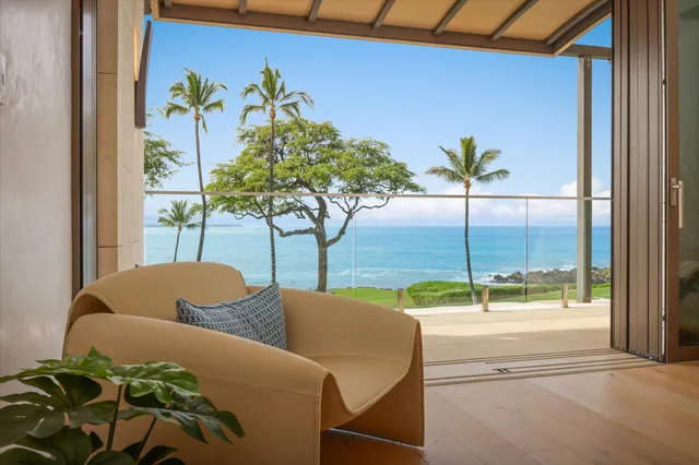 a vase of flowers sitting on a table with a potted plant