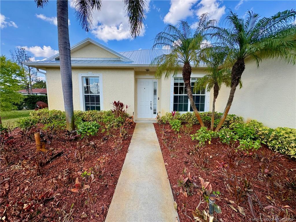 947 Northwest 13th Street Stuart, FL 34994 - Photo 1 of 23 a view of a house with a garden