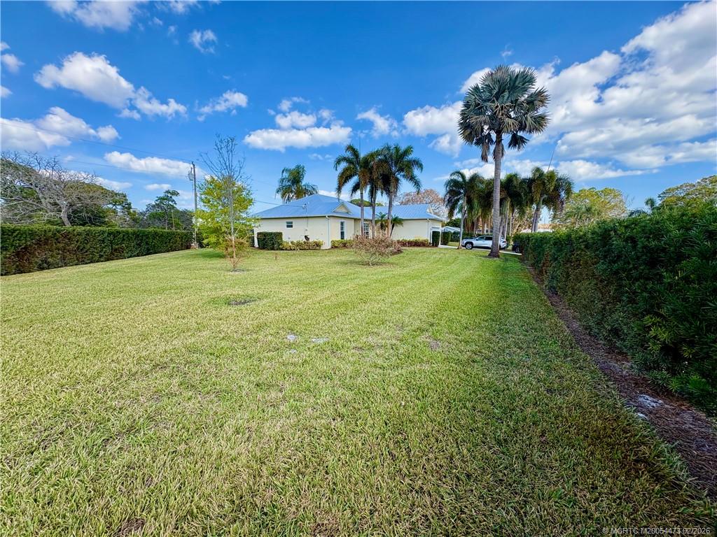 947 Northwest 13th Street Stuart, FL 34994 - Photo 18 of 23 a view of a fountain in front of the house