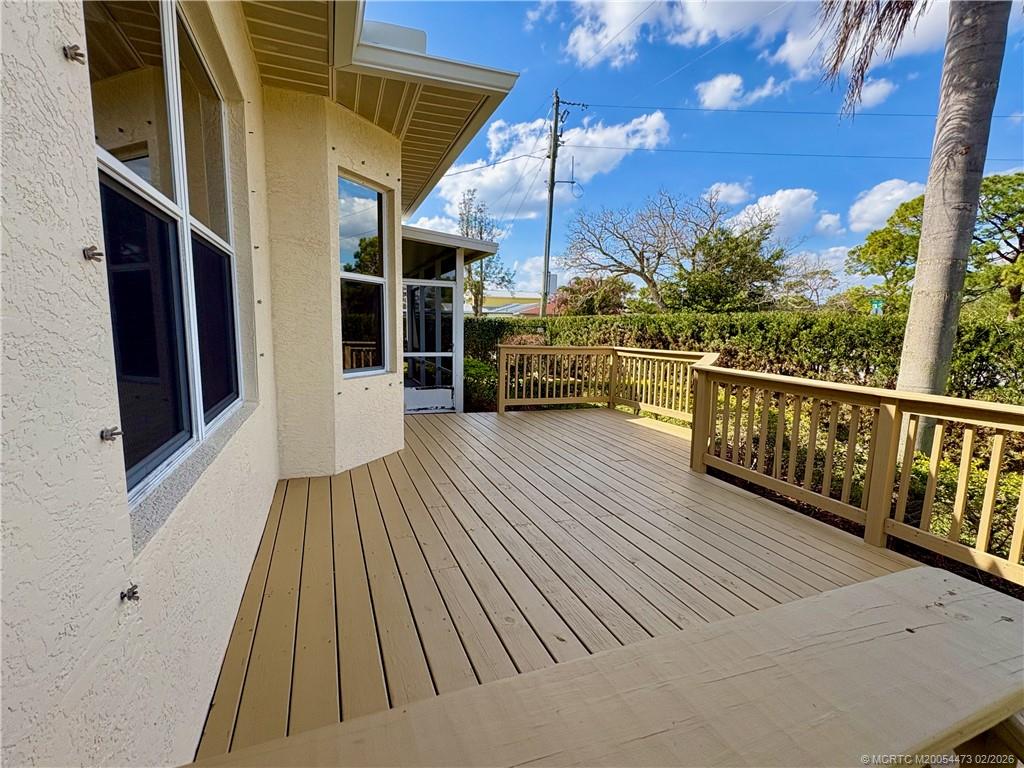 947 Northwest 13th Street Stuart, FL 34994 - Photo 22 of 23 a view of a balcony with wooden floor and fence