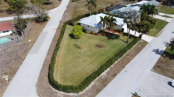 a view of a swimming pool with a yard