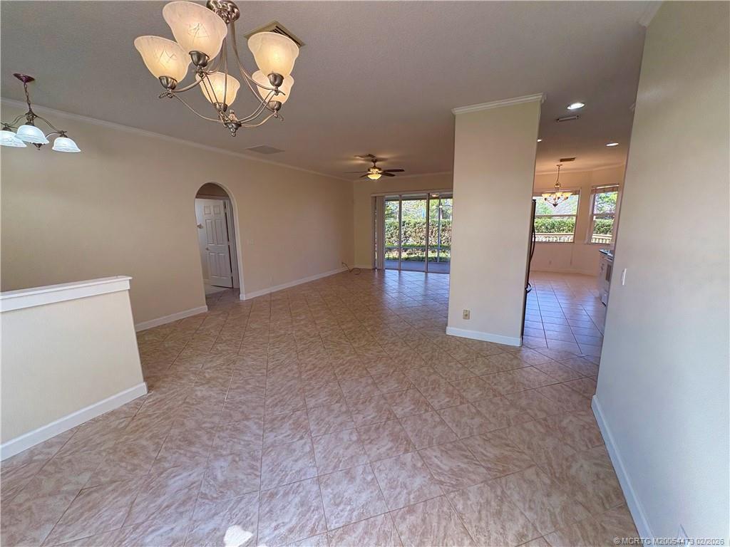 947 Northwest 13th Street Stuart, FL 34994 - Photo 6 of 23 wooden floor in an empty room with a window