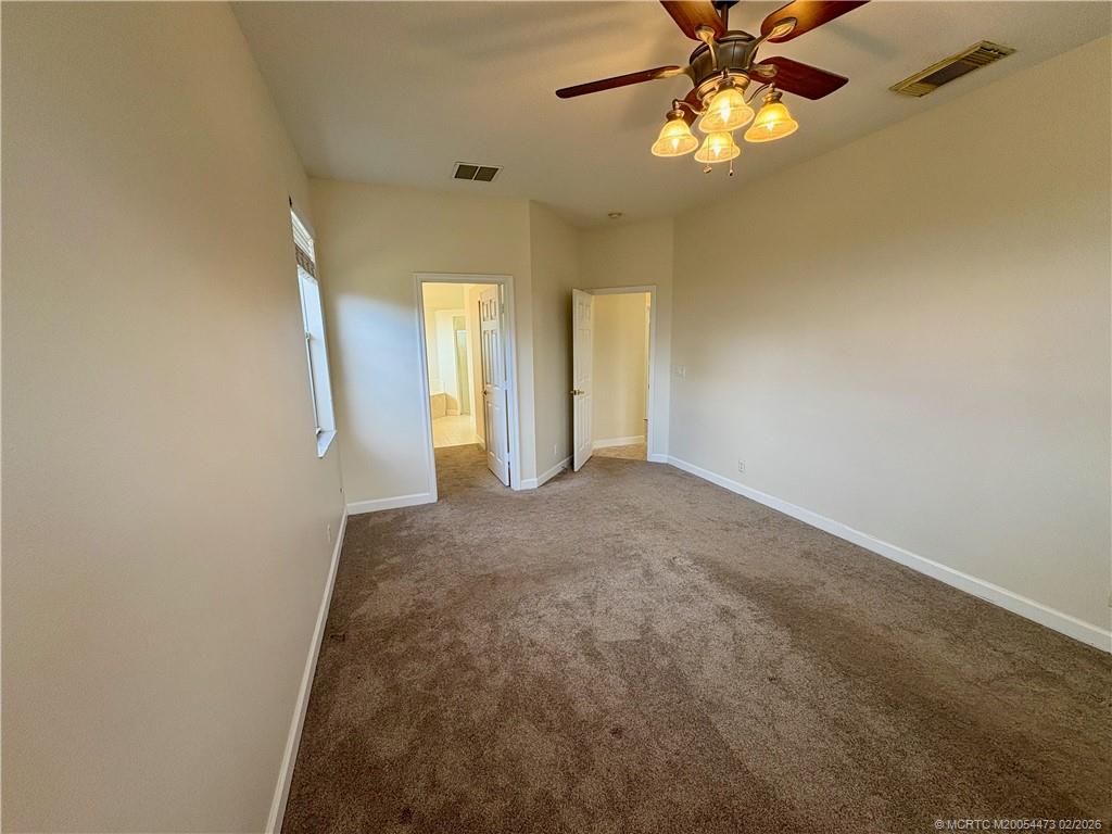 947 Northwest 13th Street Stuart, FL 34994 - Photo 9 of 23 a view of a hallway with a chandelier