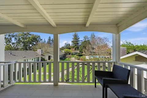 a view of a chairs and table in patio