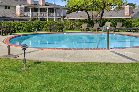a view of living room and bedroom with windows
