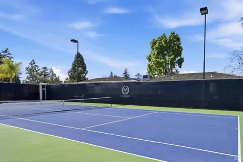 a view of a table and chairs in the garden