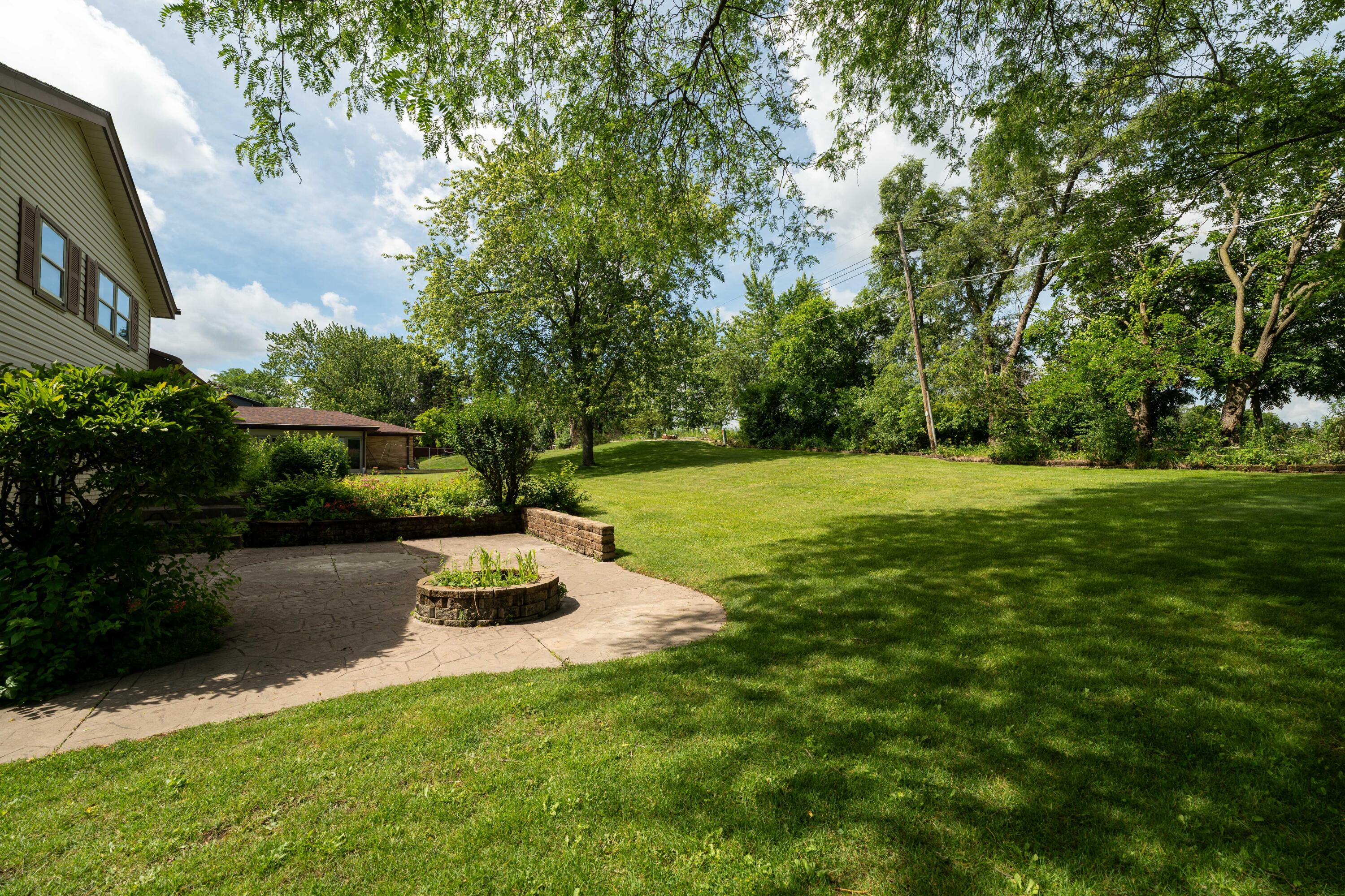4514 Ridgecrest Drive Mount Pleasant, WI 53403 - Photo 26 of 29 Stone Patio and Pretty View