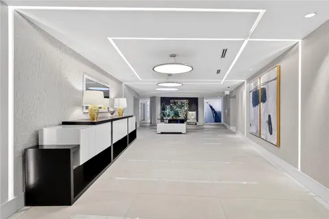 a view of living room with furniture and a chandelier