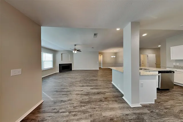 a view of a kitchen and a window