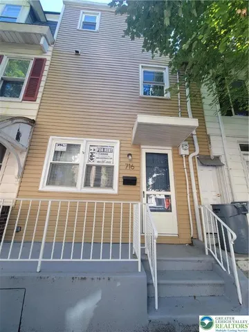 a front view of a house with deck