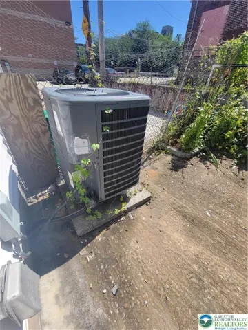 a view of a patio with a table and chairs