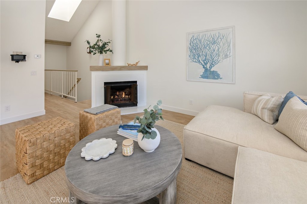 617 East Pine Avenue El Segundo, CA 90245 - Photo 13 of 31 a living room with furniture a fireplace and a table