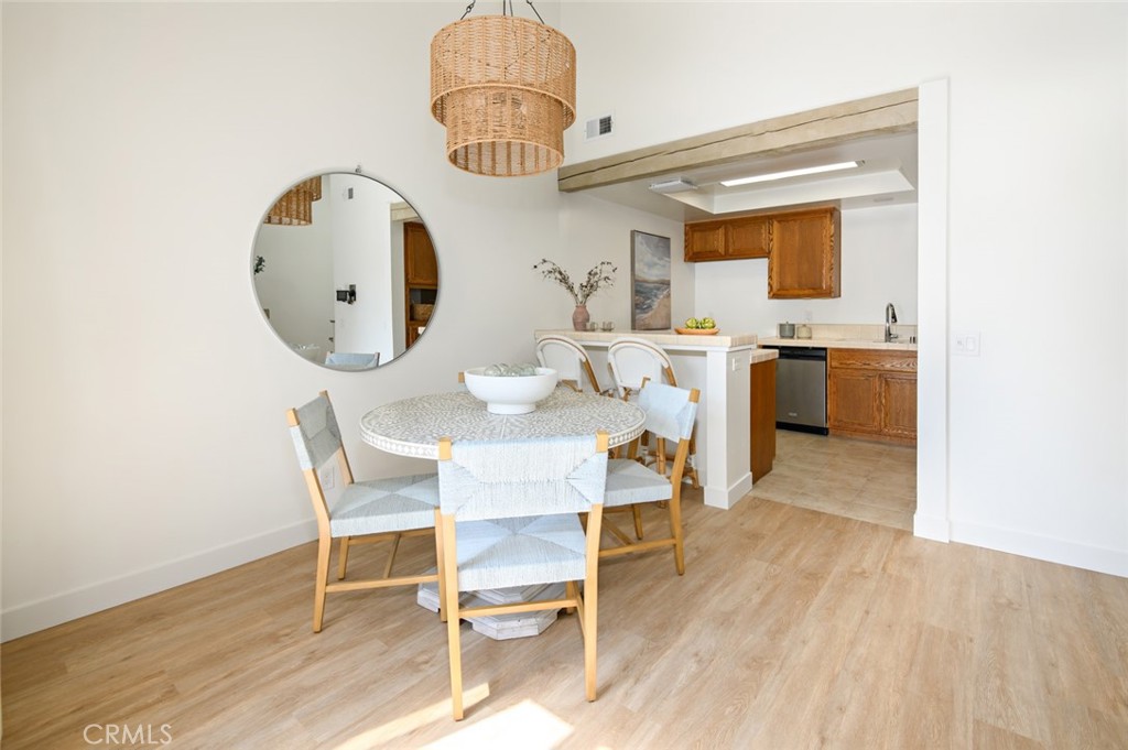 617 East Pine Avenue El Segundo, CA 90245 - Photo 17 of 31 a view of a dining room with furniture and wooden floor
