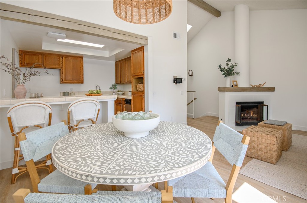 617 East Pine Avenue El Segundo, CA 90245 - Photo 18 of 31 a living room with furniture a fireplace and a table