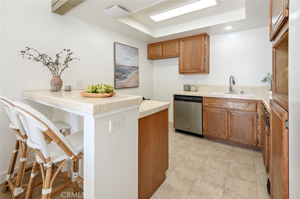617 East Pine Avenue El Segundo, CA 90245 - Photo 19 of 31 a kitchen with a sink a stove and cabinets