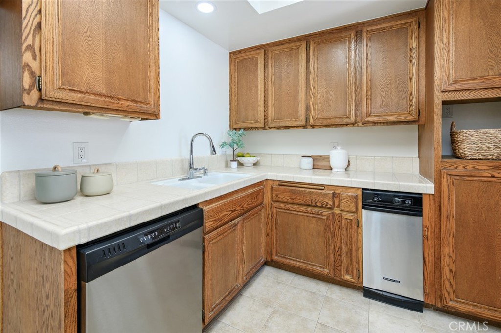 617 East Pine Avenue El Segundo, CA 90245 - Photo 21 of 31 a kitchen with stainless steel appliances granite countertop a sink stove and cabinets