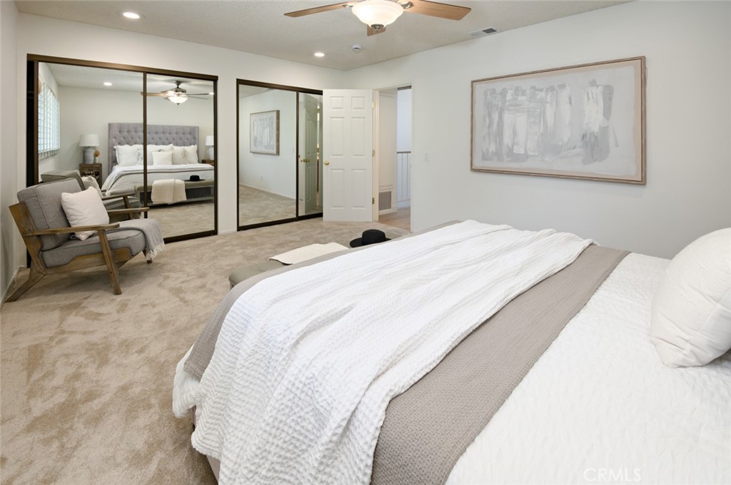 617 East Pine Avenue El Segundo, CA 90245 - Photo 24 of 31 a bedroom with a large bed and a chandelier