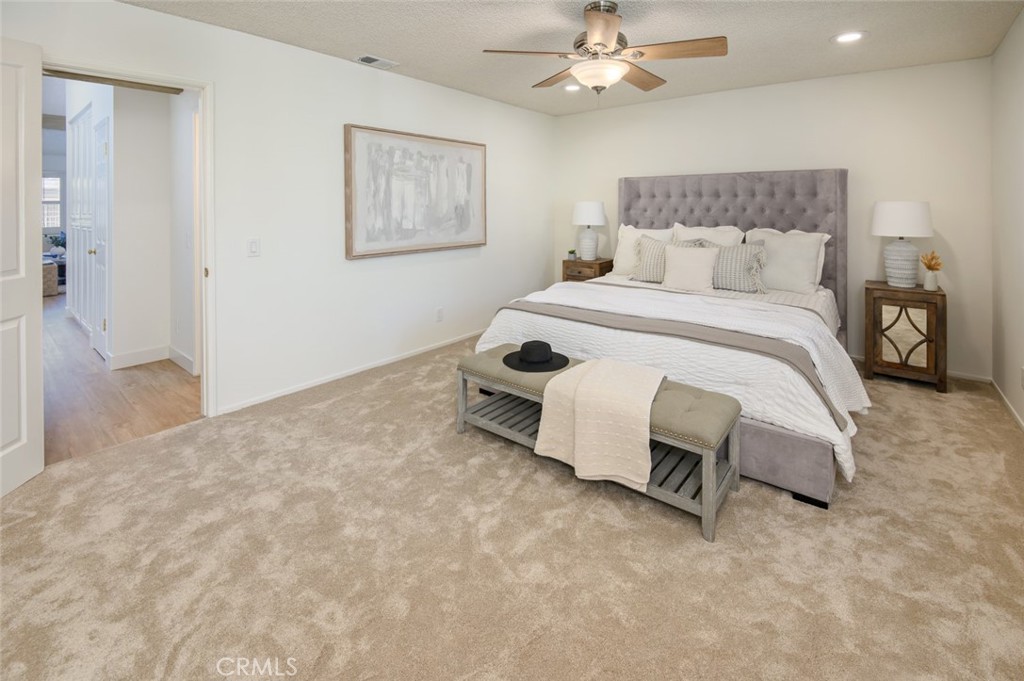 617 East Pine Avenue El Segundo, CA 90245 - Photo 25 of 31 a bedroom with a bed and a chandelier