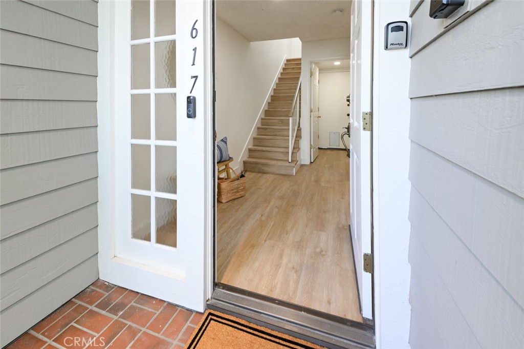 617 East Pine Avenue El Segundo, CA 90245 - Photo 5 of 31 a view of a hallway with wooden floor and staircase