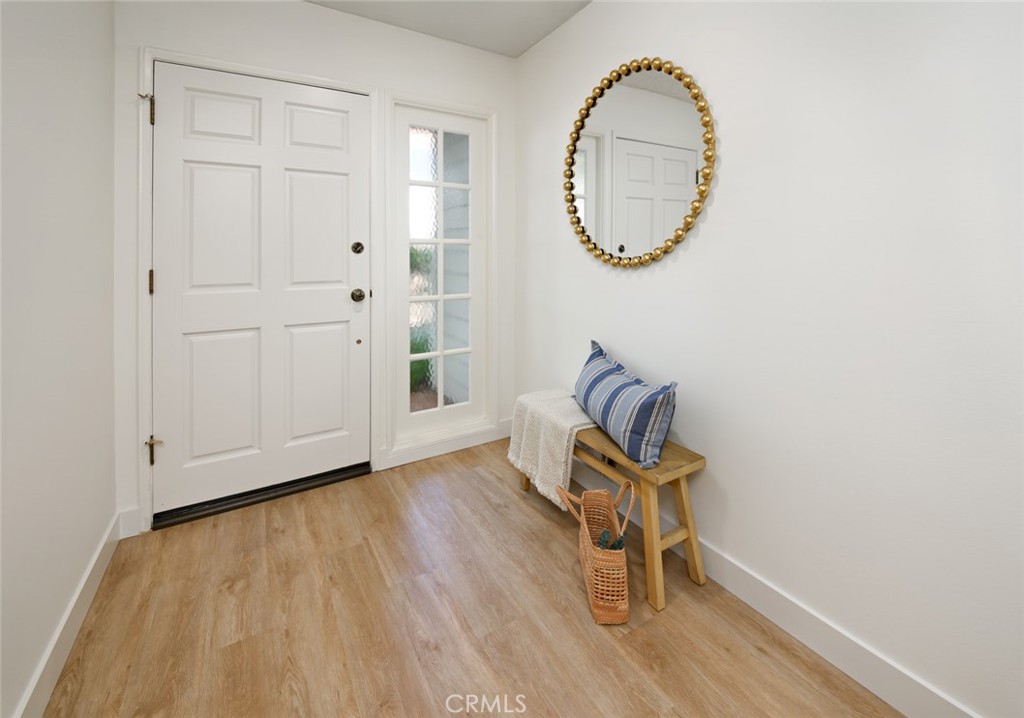 617 East Pine Avenue El Segundo, CA 90245 - Photo 7 of 31 an entryway with wooden floor and mirror