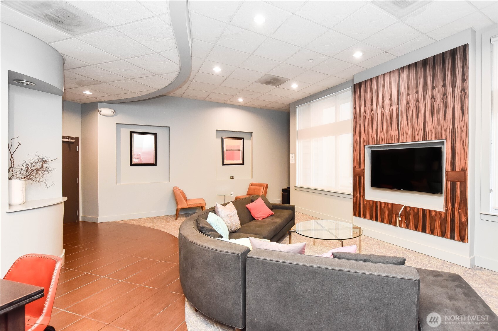159 Denny Way, Unit 402 Seattle, WA 98109 - Photo 13 of 23 a living room with furniture and a flat screen tv