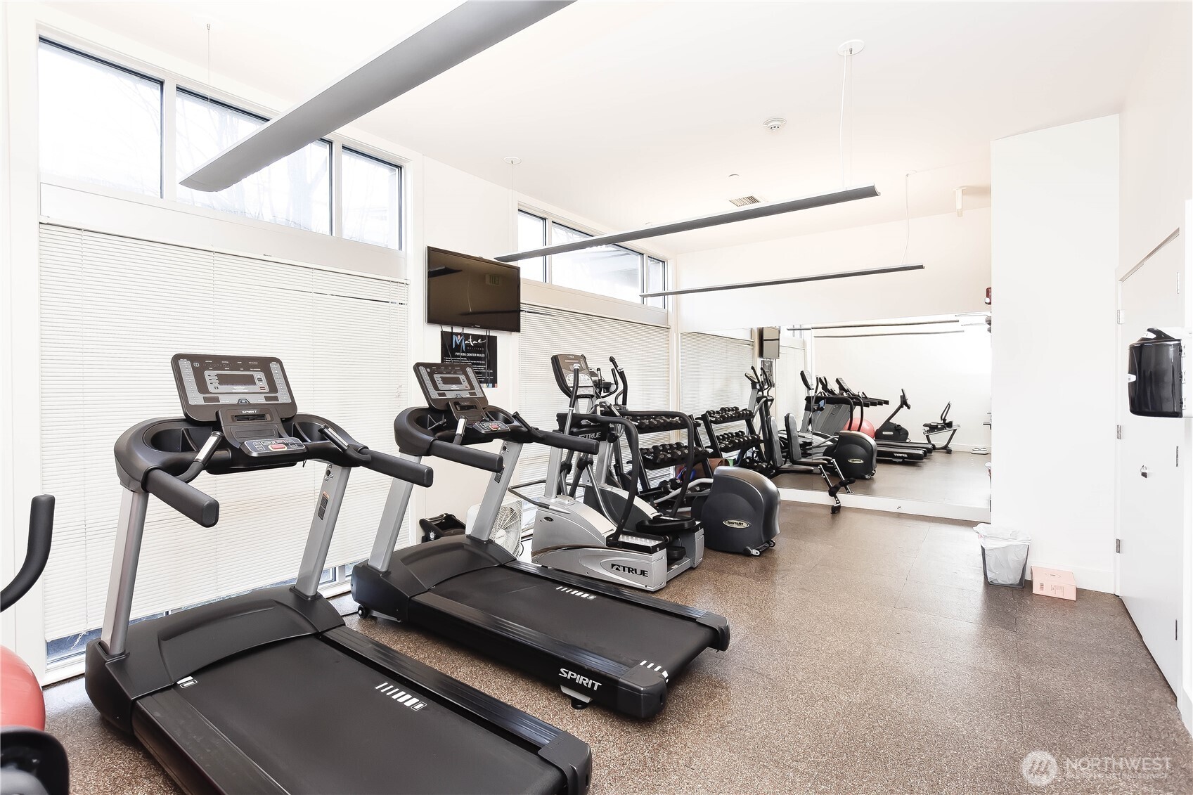 159 Denny Way, Unit 402 Seattle, WA 98109 - Photo 16 of 23 a view of a room with gym equipment