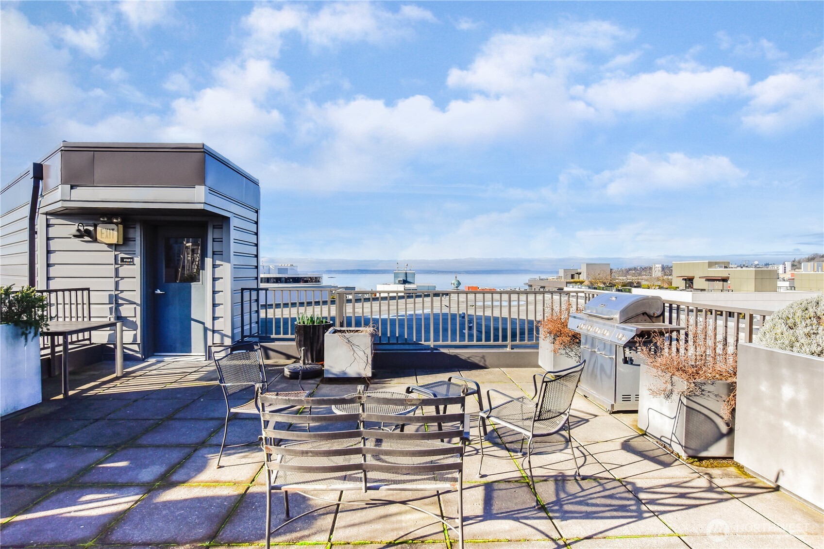 159 Denny Way, Unit 402 Seattle, WA 98109 - Photo 21 of 23 a view of a patio with swimming pool