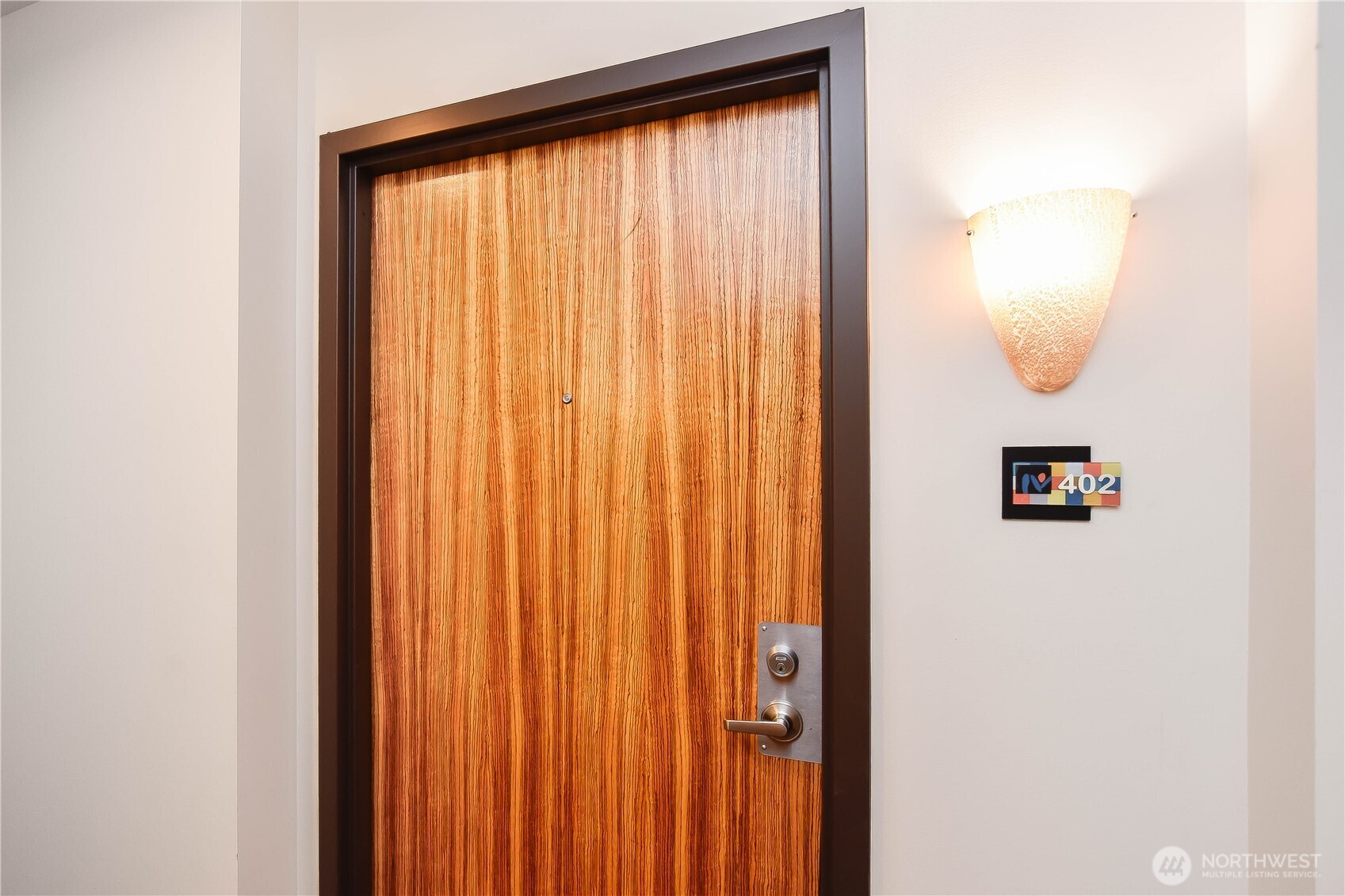 159 Denny Way, Unit 402 Seattle, WA 98109 - Photo 23 of 23 an entryway with wooden floor
