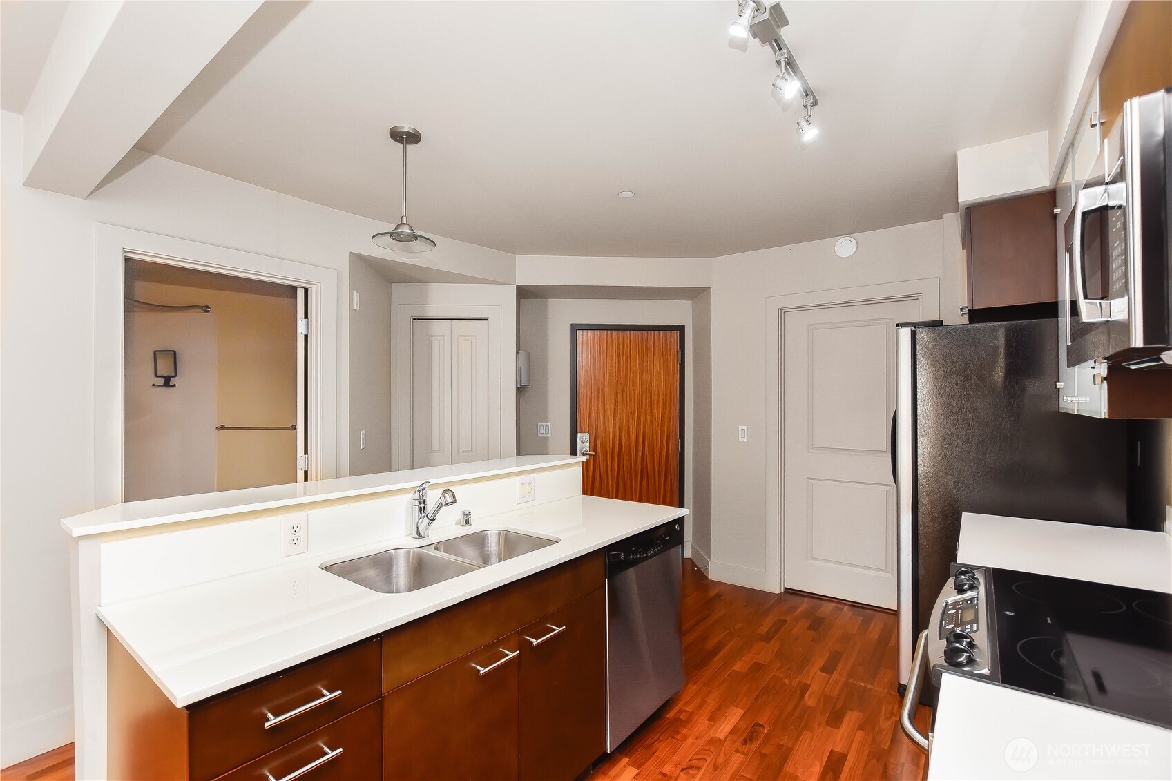 159 Denny Way, Unit 402 Seattle, WA 98109 - Photo 4 of 23 a spacious bathroom with a sink double vanity and a mirror
