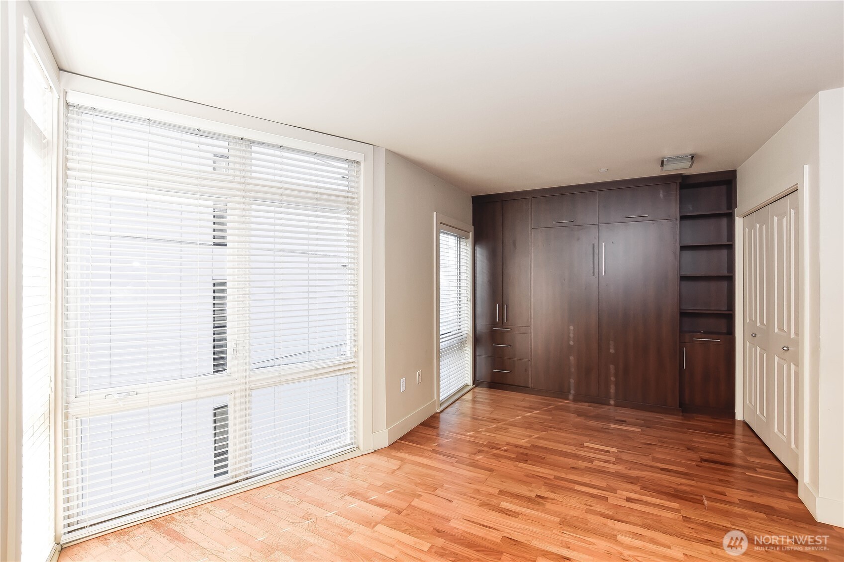 159 Denny Way, Unit 402 Seattle, WA 98109 - Photo 7 of 23 a view of a livingroom with wooden floor