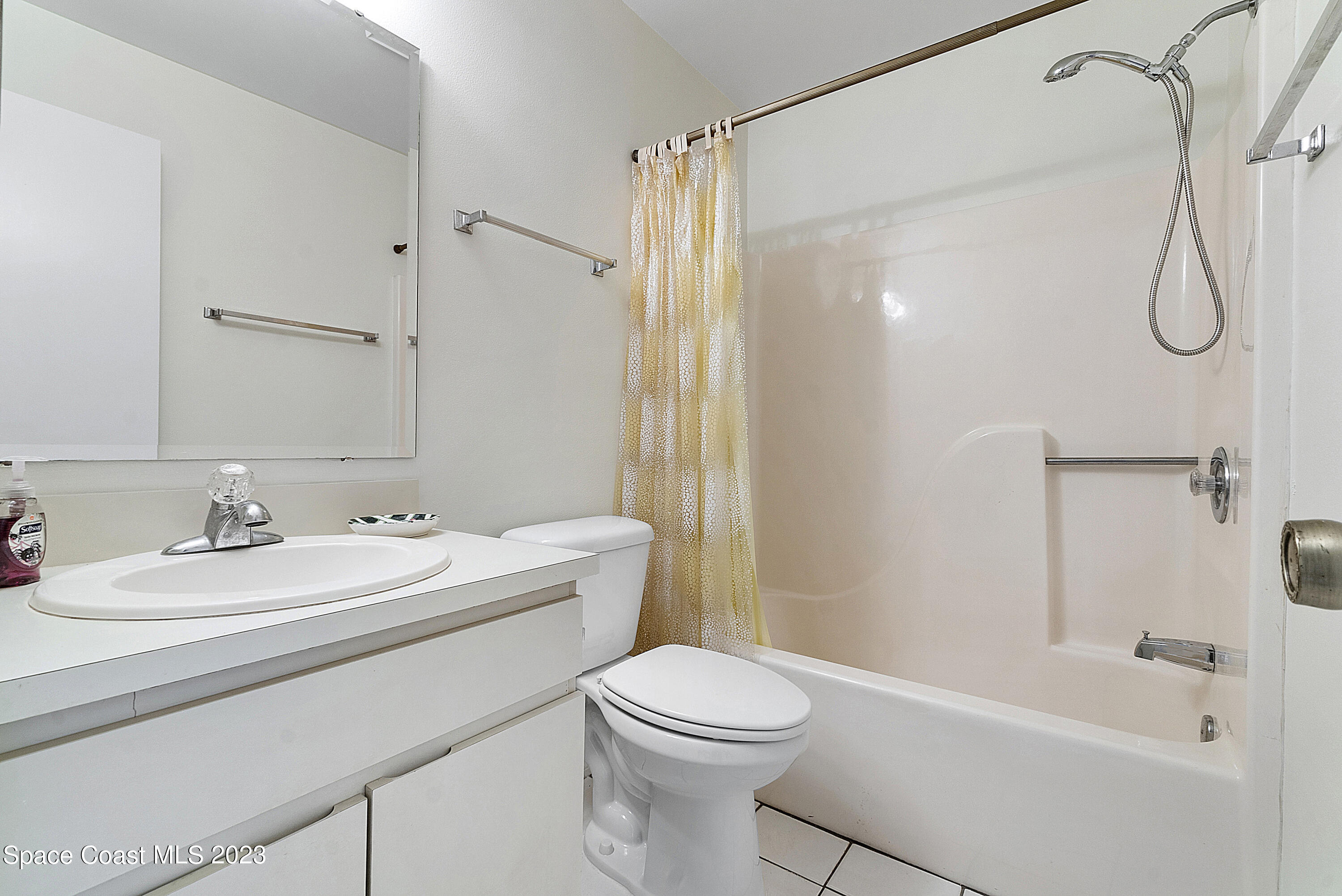 1720 Murrell Road, Unit 203 Rockledge, FL 32955 - Photo 11 of 13 a bathroom with a sink a toilet and shower