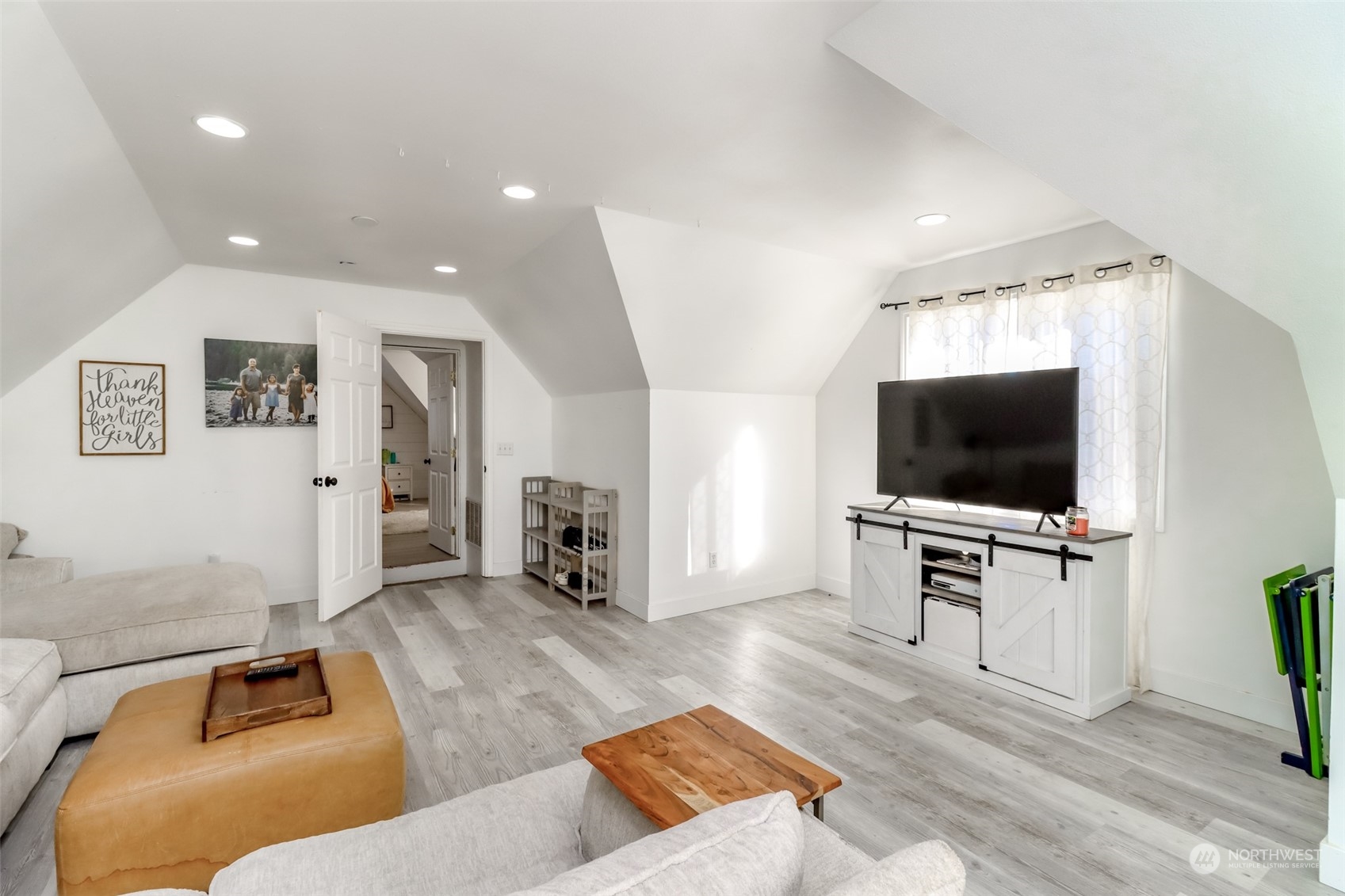1355 McHugh Avenue Enumclaw, WA 98022 - Photo 22 of 35 a living room with furniture and a flat screen tv