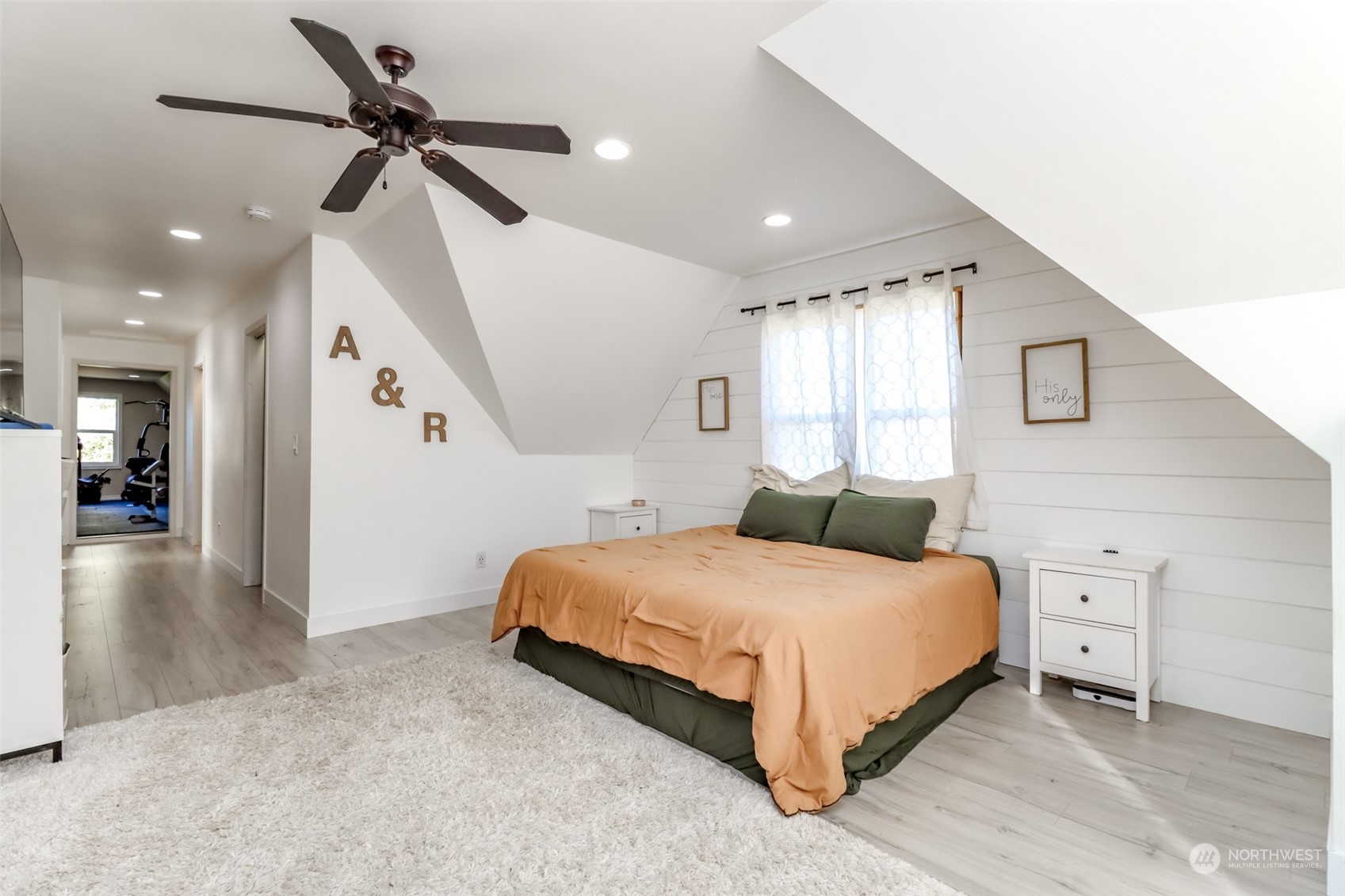 1355 McHugh Avenue Enumclaw, WA 98022 - Photo 24 of 35 a bedroom with a bed and a chandelier