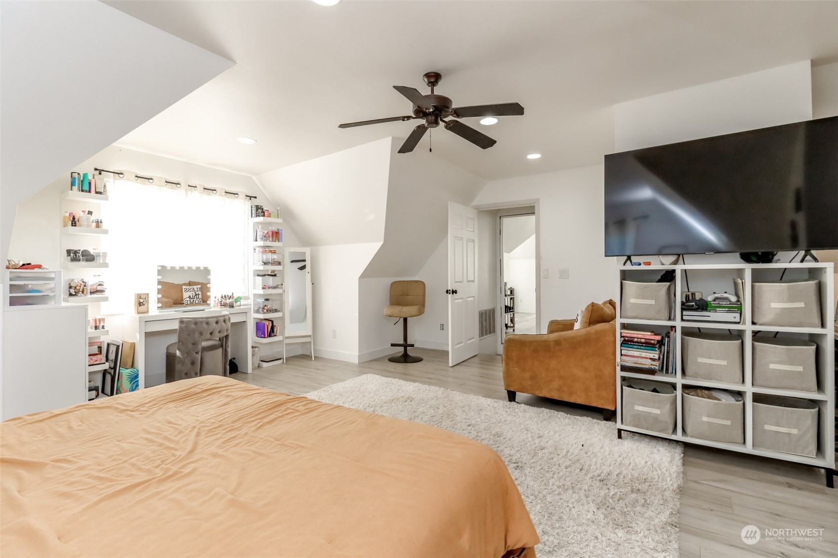 1355 McHugh Avenue Enumclaw, WA 98022 - Photo 26 of 35 a bedroom with a bed and a flat tv screen on dresser