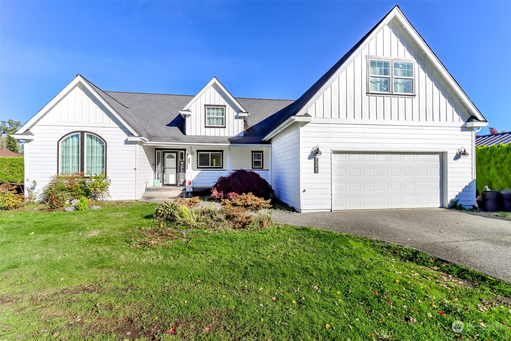 1355 McHugh Avenue Enumclaw, WA 98022 - Photo 3 of 35 a view of a house with a small yard and plants