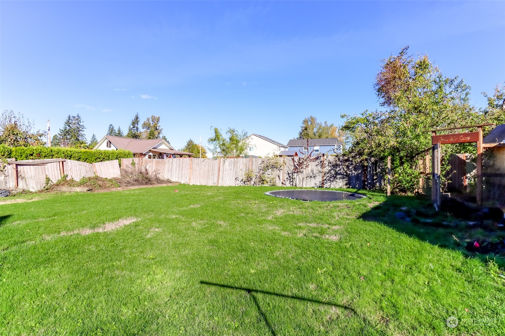 1355 McHugh Avenue Enumclaw, WA 98022 - Photo 31 of 35 a view of yard with grass and a bench in the background