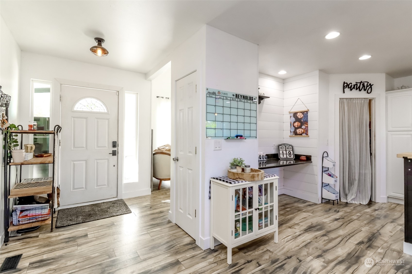 1355 McHugh Avenue Enumclaw, WA 98022 - Photo 6 of 35 a kitchen with stainless steel appliances a stove top oven a refrigerator and cabinets