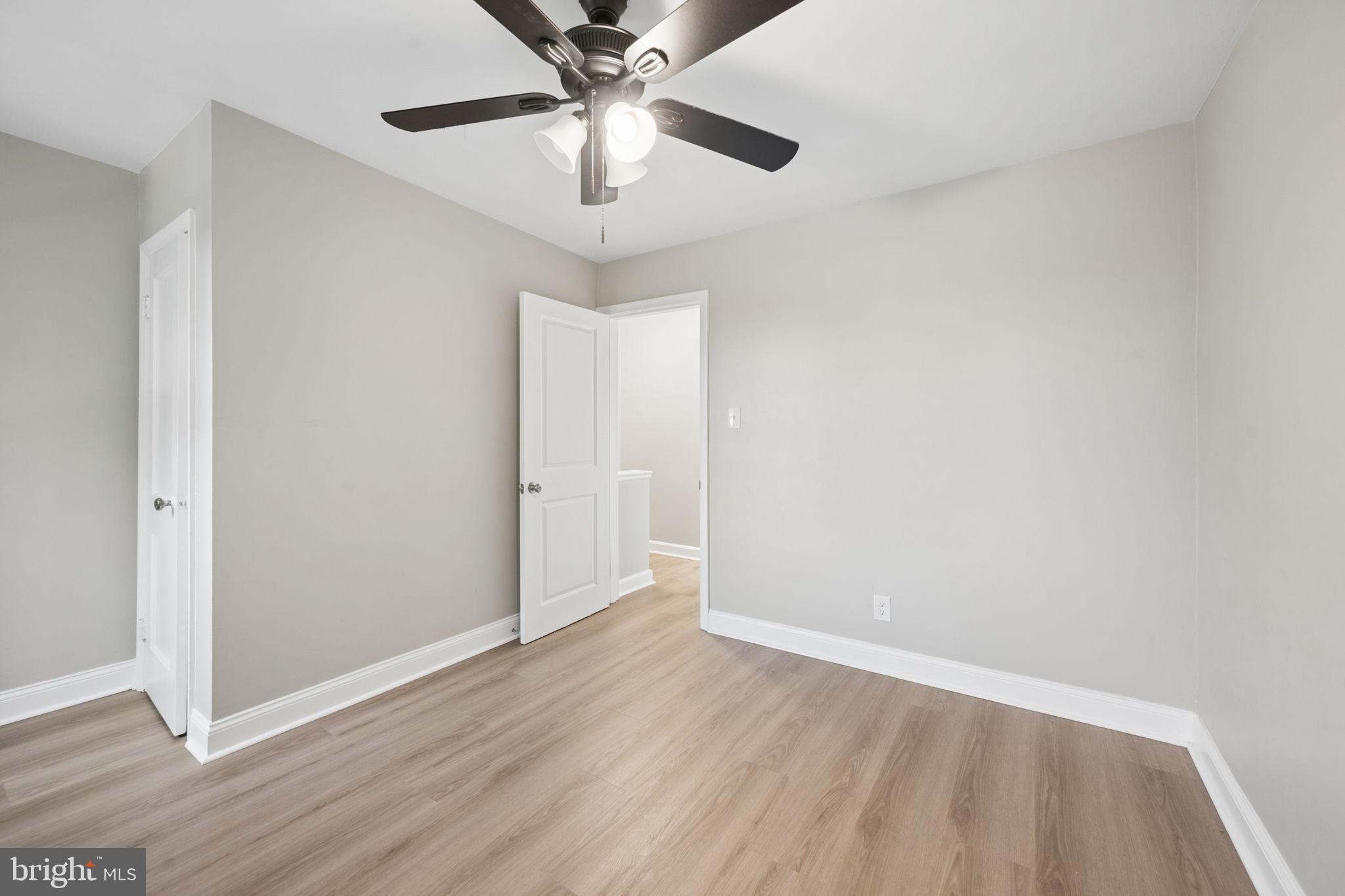 3548 Benzinger Road Baltimore, MD 21229 - Photo 23 of 40 a view of an empty room with wooden floor