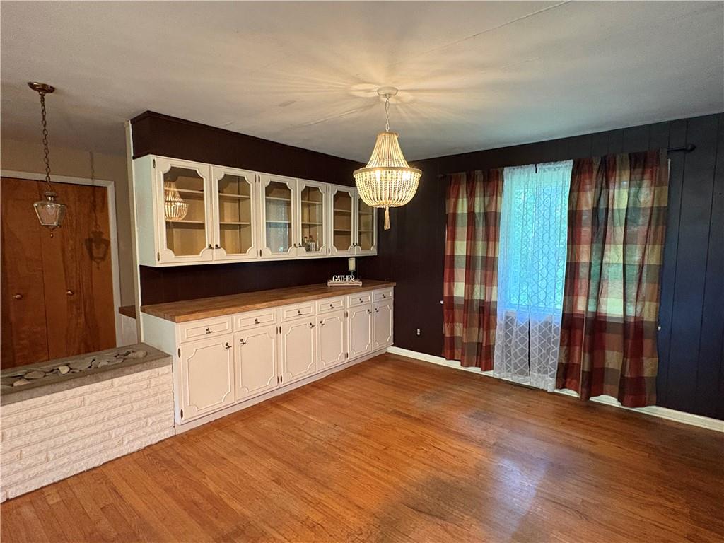 320 Cherry Hill Road Greenville, PA 16125 - Photo 13 of 38 a view of a kitchen with wooden floor and windows