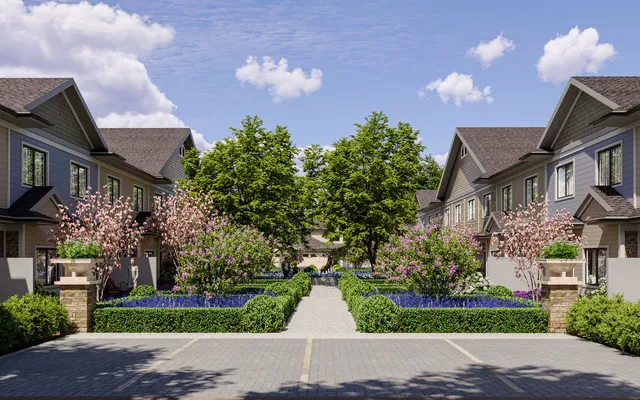 a front view of a house with a yard and fountain in middle