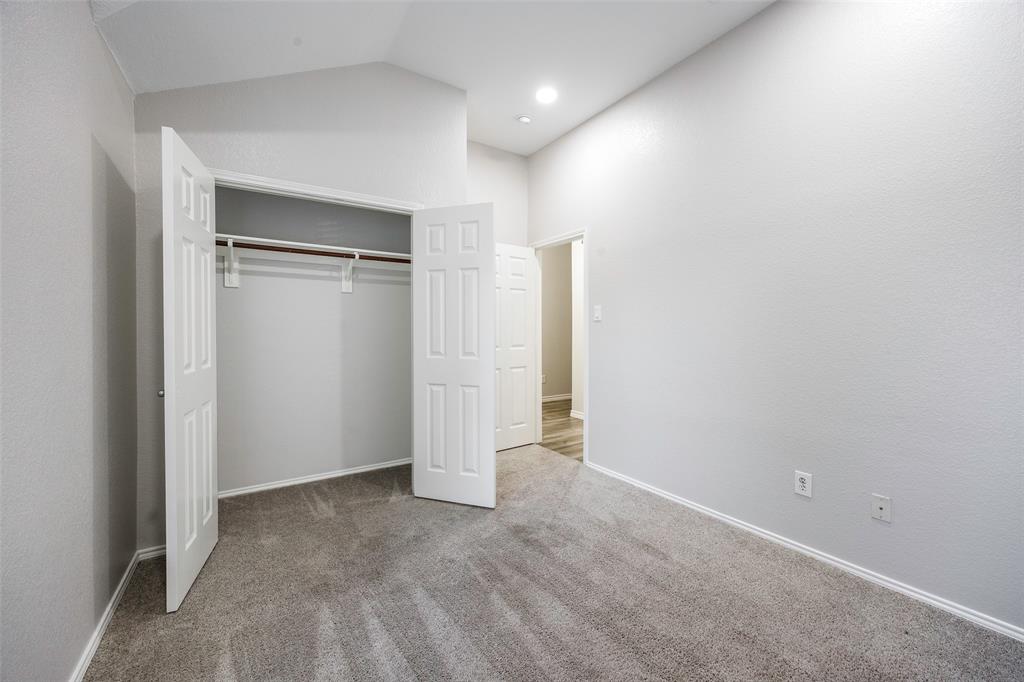 3603 Cottonwood Road Melissa, TX 75454 - Photo 15 of 27 Unfurnished bedroom with carpet floors, vaulted ceiling, and a closet