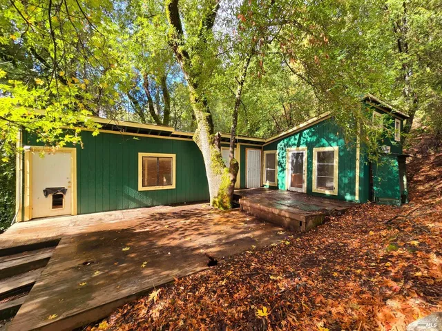 a backyard of a house with seating space