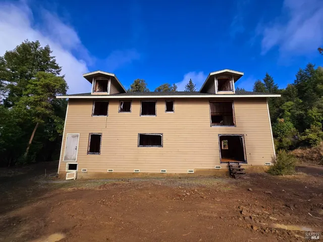 a front view of a house with yard