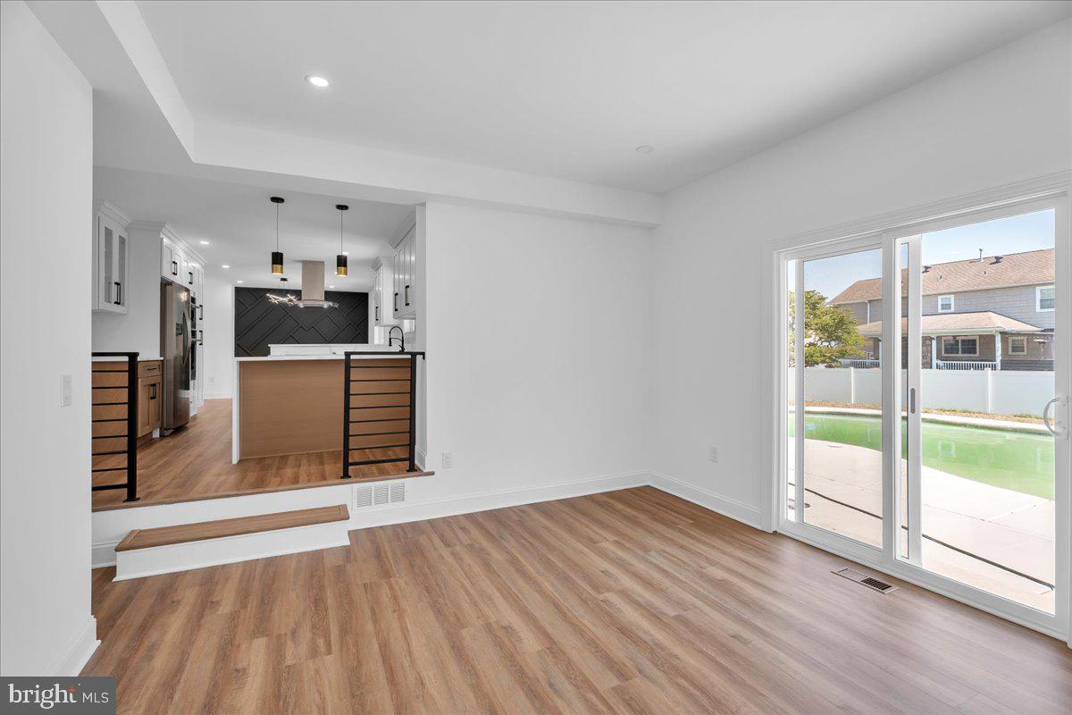 2504 Church Road Cinnaminson, NJ 08077 - Photo 22 of 79 a view of a kitchen with wooden floor and electronic appliances