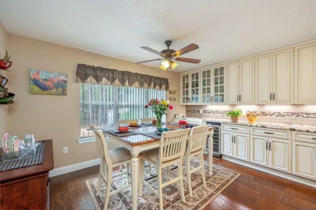 a kitchen with a dining table and chairs