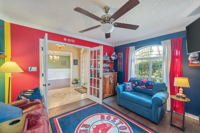 a living room with furniture and a large window