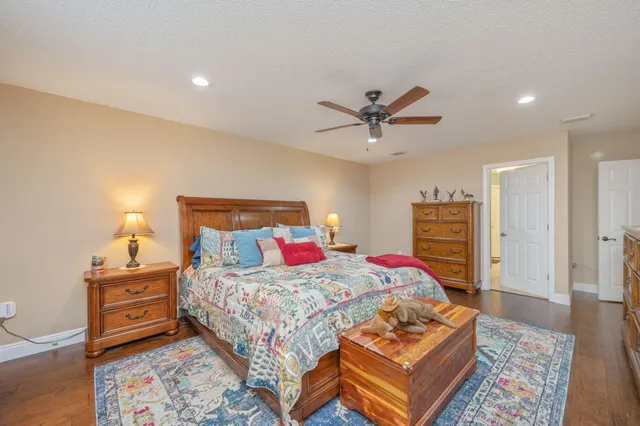 a bedroom with a bed and dresser