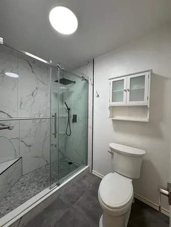 a bathroom with a double vanity sink and mirror